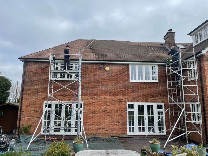 Roof cleaning carried out safely from scaffold towers by The Roof Moss Cleaners in High Wycombe